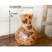 This is a handmade gourd vase. The front has butterfly artwork drawn on using pyrography tools. It is 10 inches tall and 5.5 inches wide.